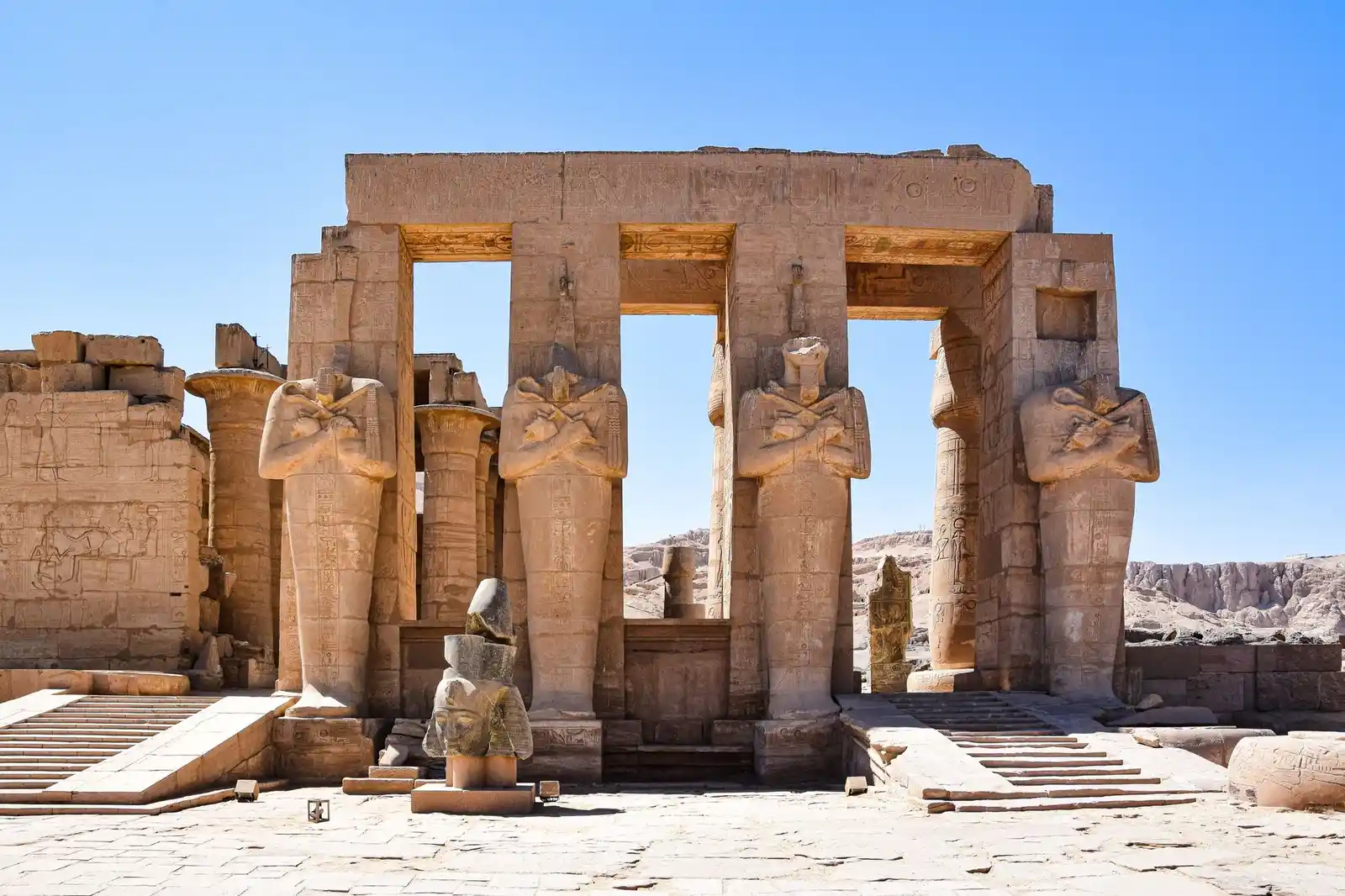 Ramesseum temple ruins with fallen colossal statue in Luxor