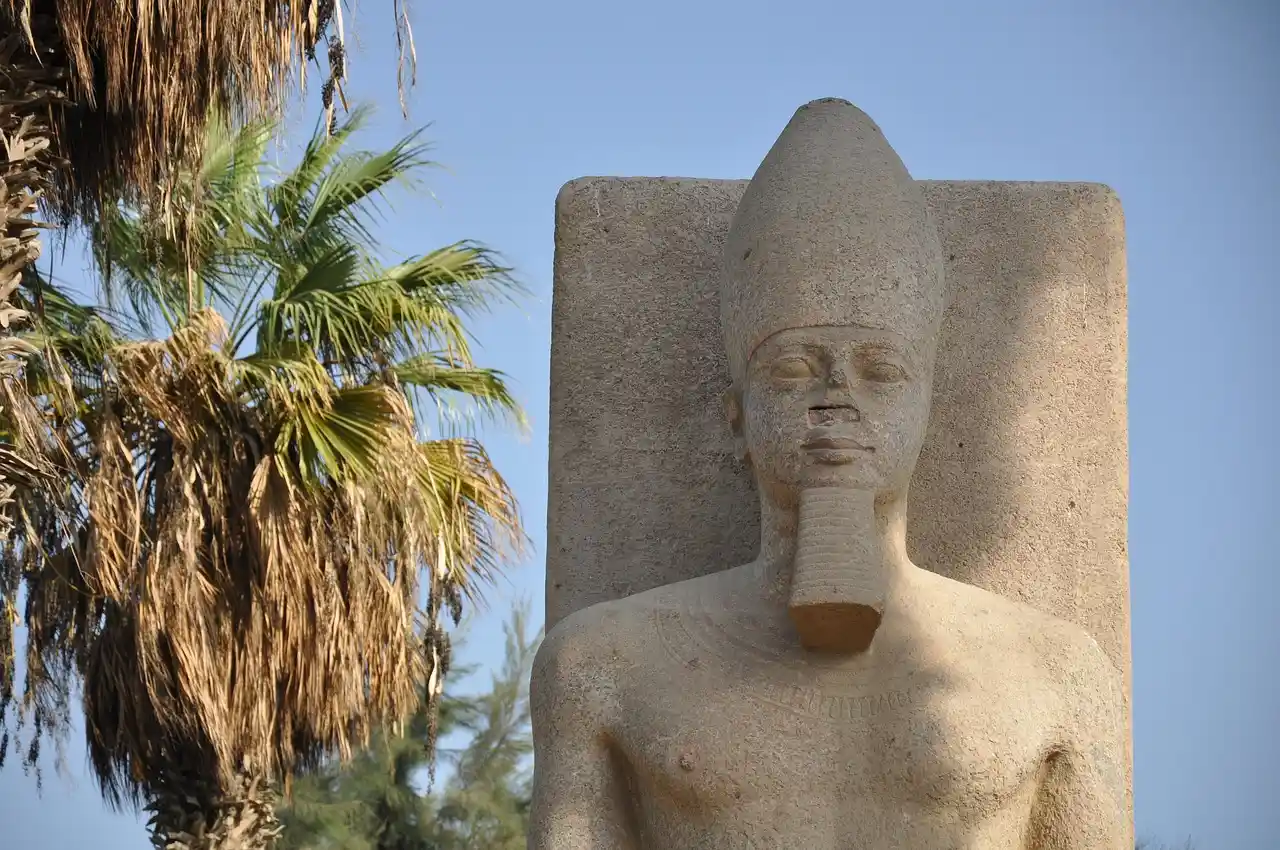Hieroglyphs, statues and the river at Memphis colossus in Mit Rahina, Egypt