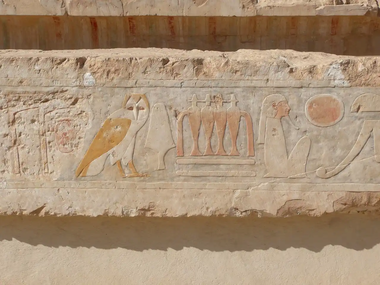 Hieroglyphs, carved reliefs, paintings and a tomb at Temple of Hatshepsut in Luxor, Egypt