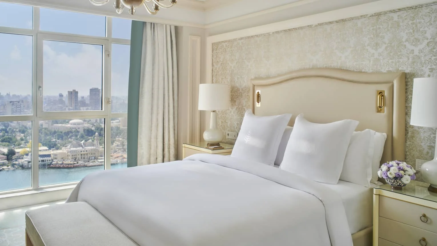 Guest room at Four Seasons Hotel Cairo with Nile and city skyline views