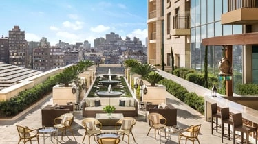 Rooftop terrace lounge with fountain at St Regis Hotel Cairo