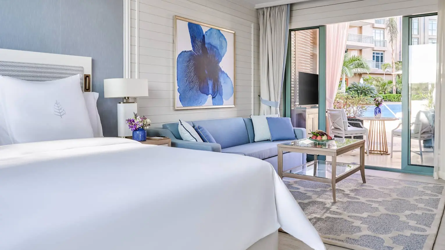 Poolside suite bedroom at Four Seasons Nile Plaza Cairo with garden views