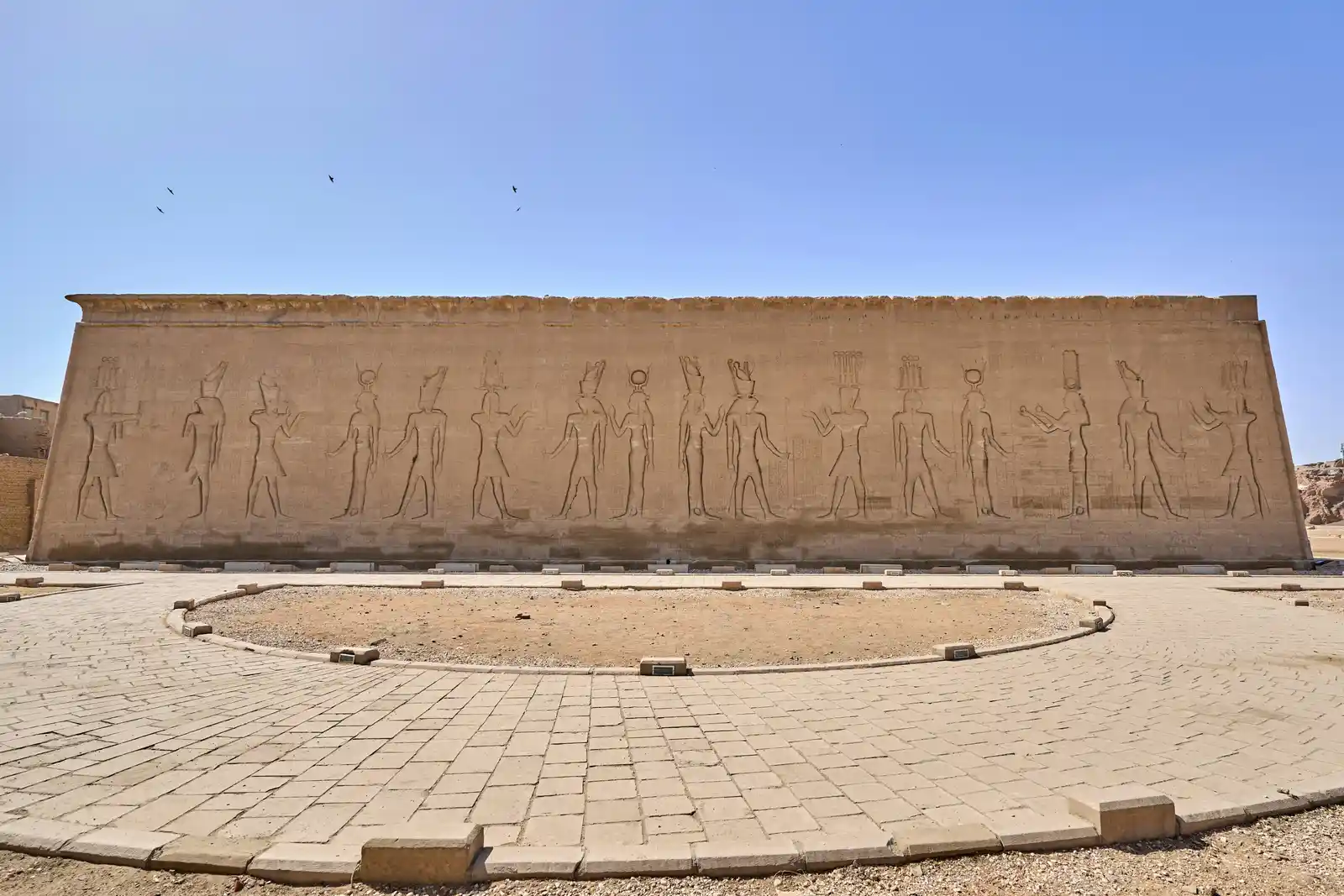 Statues, a temple, walls and stone at Edfu