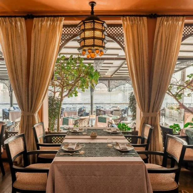 Restaurant seating at Sofitel Cairo Nile El Gezirah with Nile River views