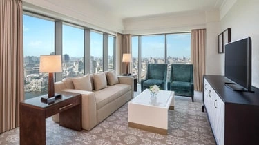 Suite living room at The St Regis Cairo with Nile and city views