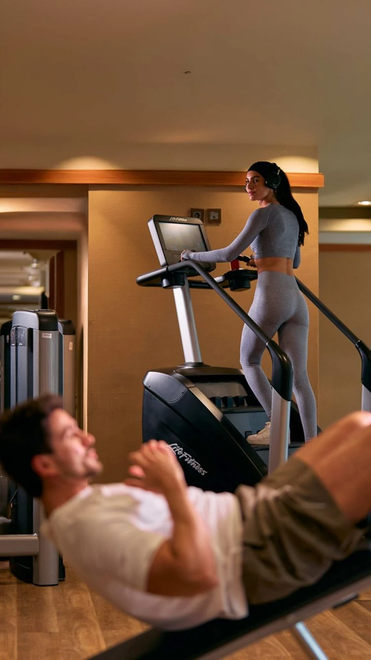 Guests working out in the fitness center at The Nile Ritz-Carlton Cairo