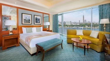 Suite bedroom at The Nile Ritz-Carlton Cairo with city views