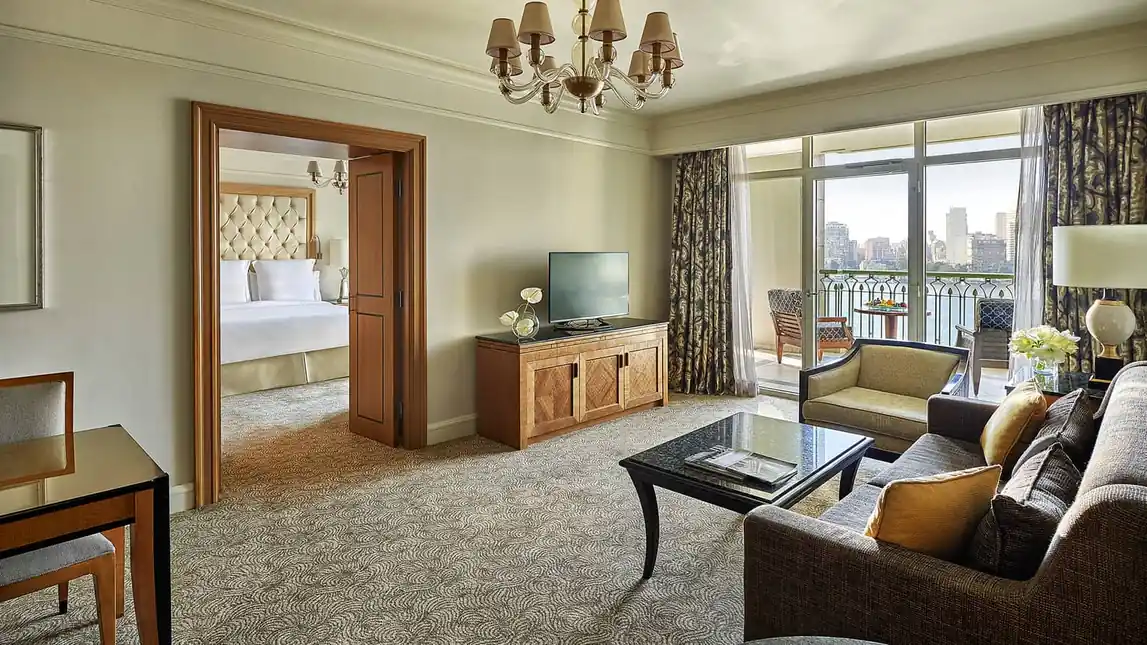 Suite living room at Four Seasons Nile Plaza Cairo with a Nile-view balcony