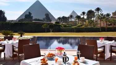Breakfast terrace at Mena House Hotel Cairo overlooking the Giza Pyramids