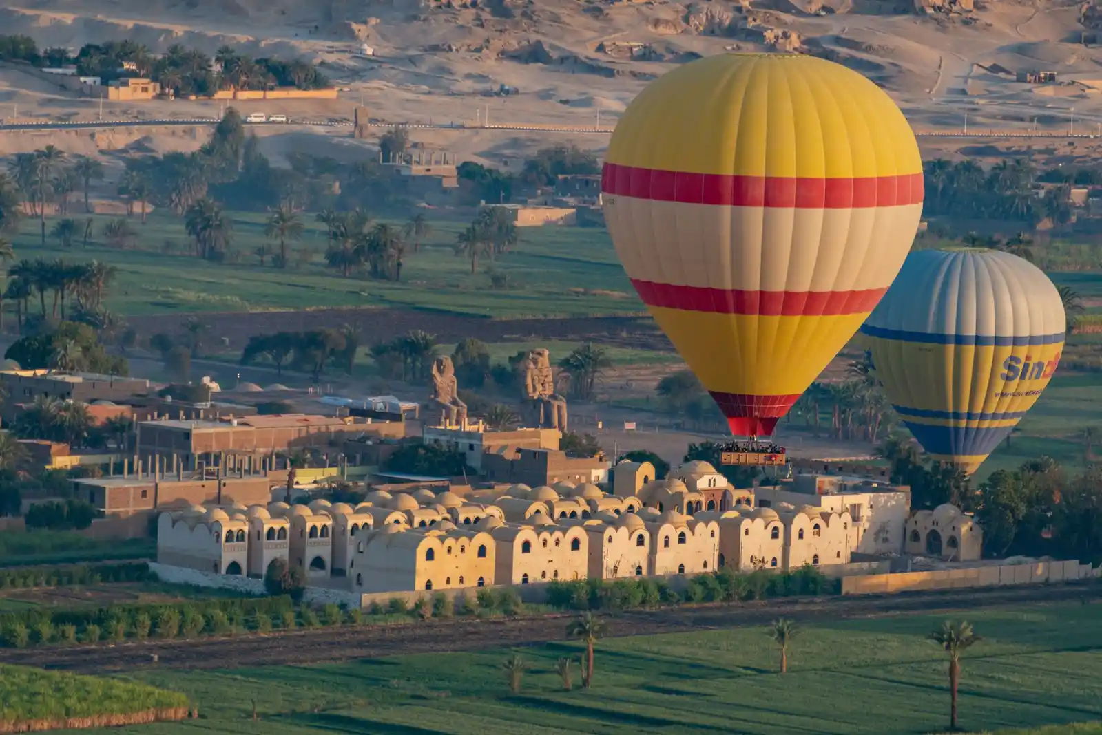Colossi of Memnon statues on the Theban plain in Luxor