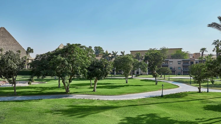 Landscaped gardens at Marriott Mena House Cairo with the Great Pyramid in the background