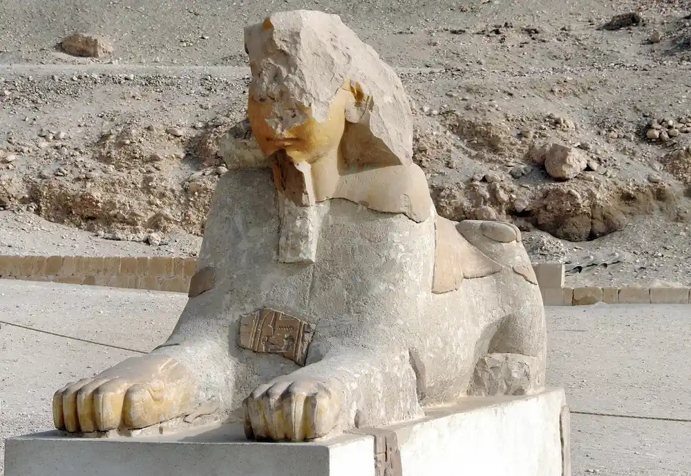 Statues and desert sand in Luxor, Egypt