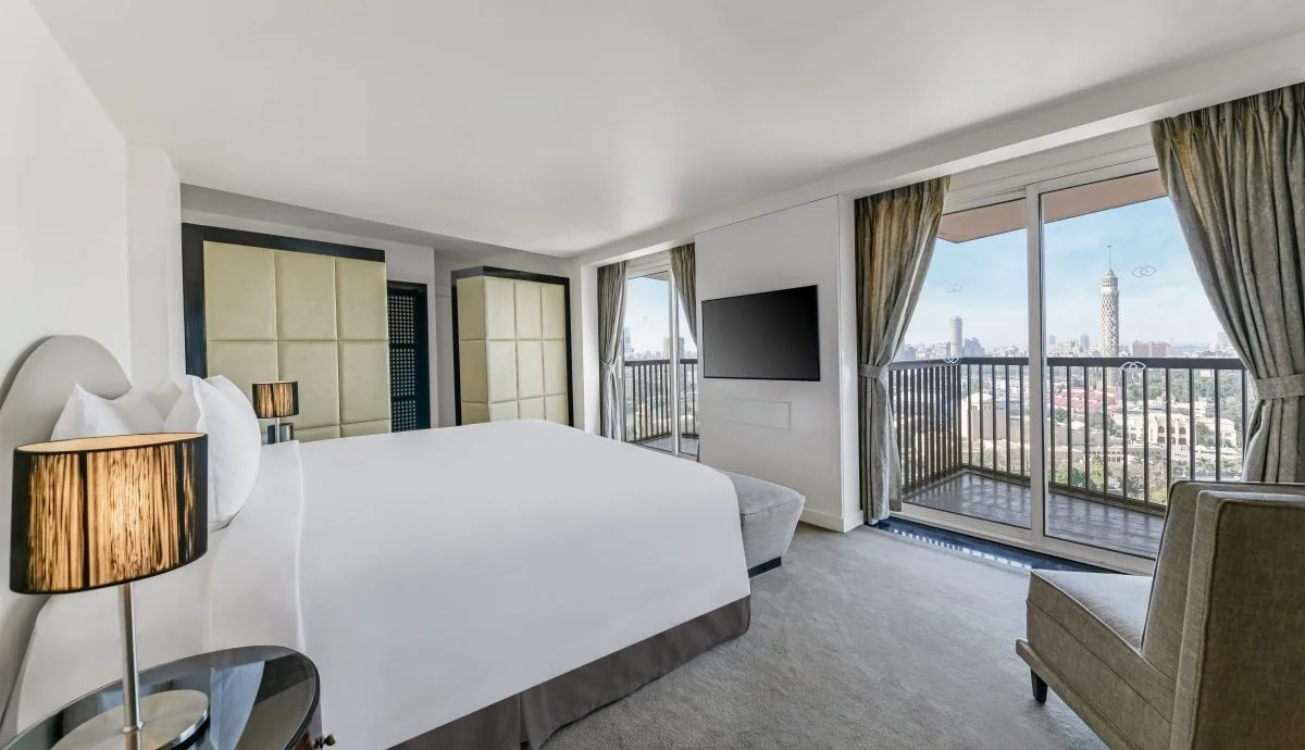 Suite bedroom at Sofitel Cairo Nile El Gezirah with a Cairo Tower view