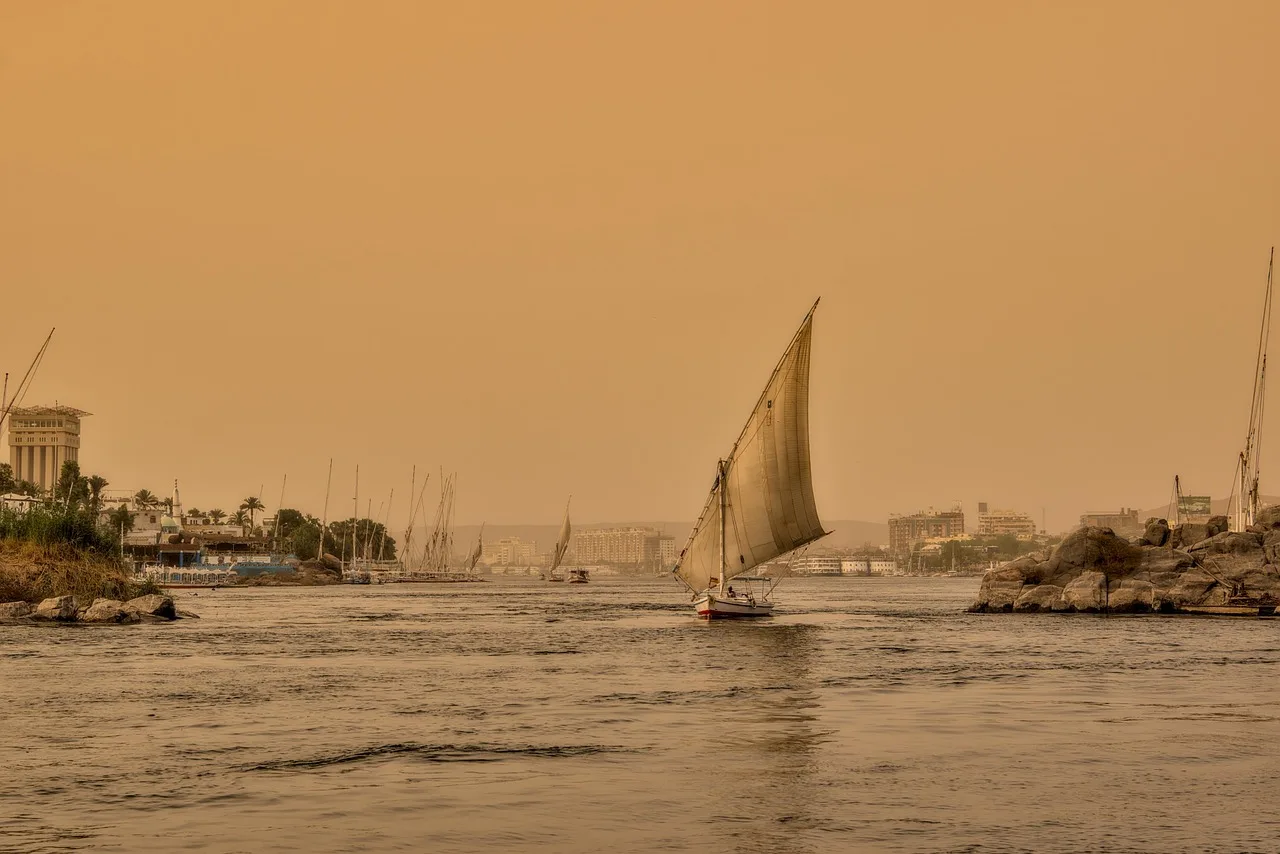 A boat and the river at Nile near Qena in Egypt at sunset