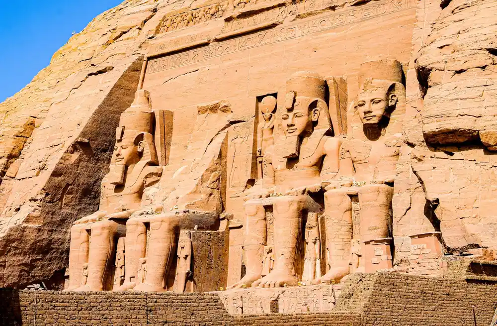 Carved reliefs, statues and a temple at Abu Simbel in Aswan