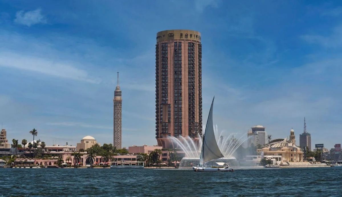 Sofitel Cairo Nile El Gezirah exterior overlooking the Nile River with a traditional felucca sailing by