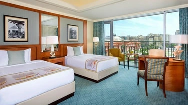 Twin room with a private balcony at The Nile Ritz-Carlton Cairo overlooking the city