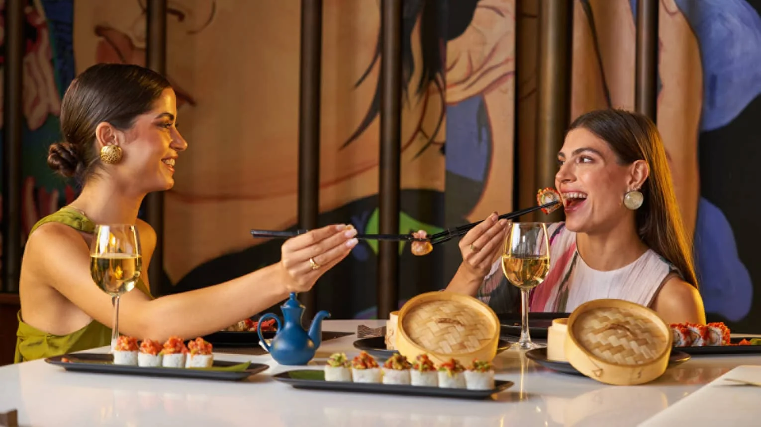 Guests enjoying sushi and Asian-inspired dining at Four Seasons Hotel Cairo at The First Residence