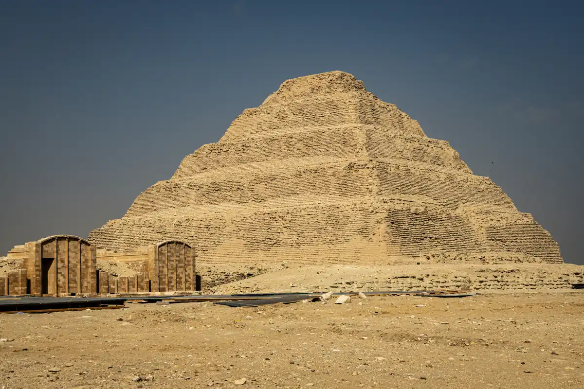 Pyramids, dunes, desert sand and stone at Saqqara in Cairo, Egypt in sunlight
