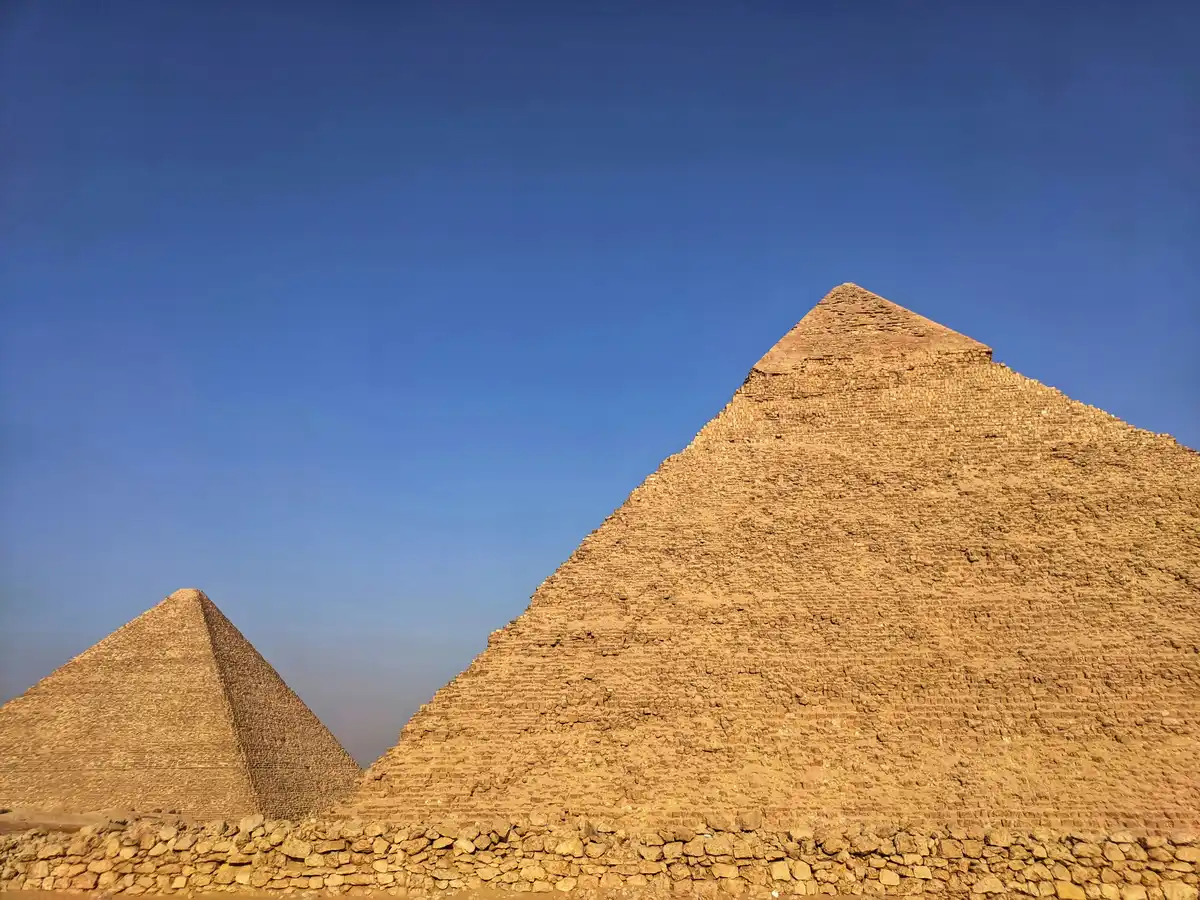 Giza Pyramids under a blue sky in daylight