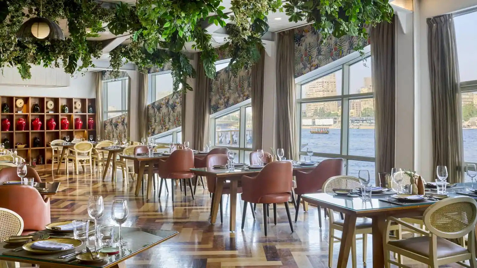 Restaurant interior with waterfront views at Four Seasons Hotel Cairo at The First Residence