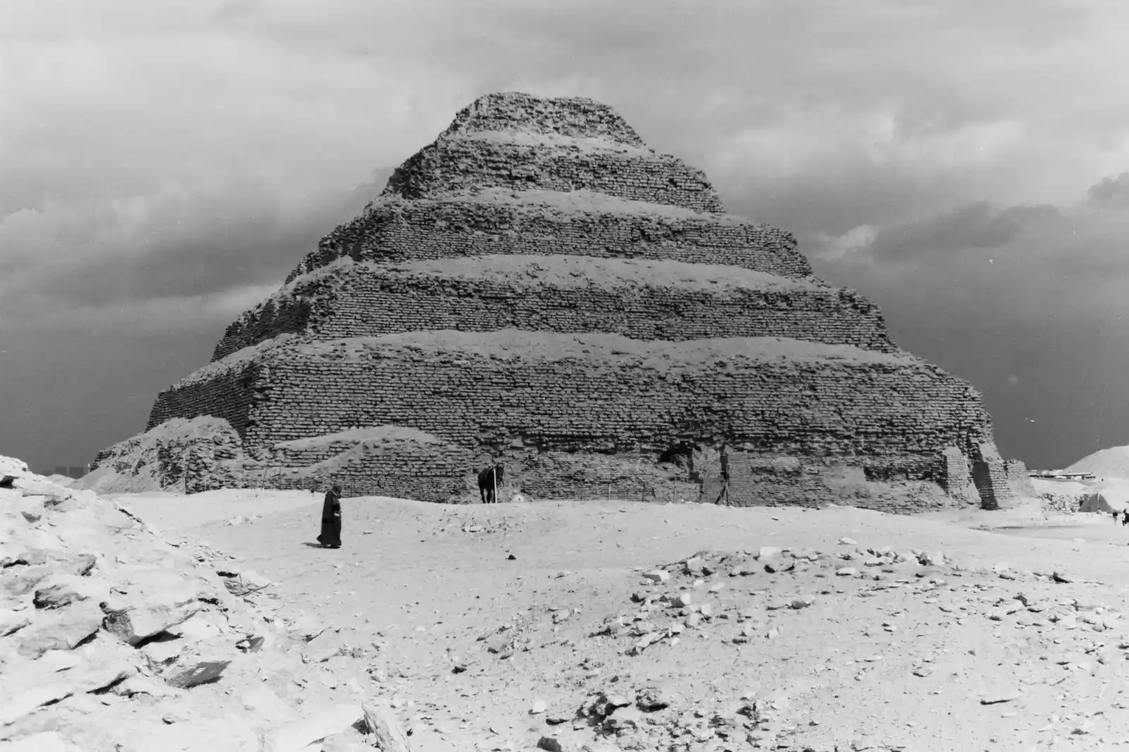 Stepped limestone terraces of Djoser's pyramid rising from the Saqqara desert